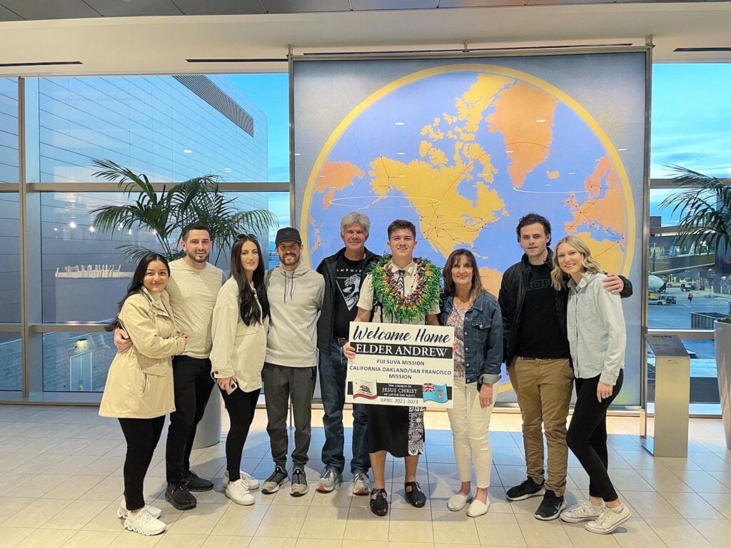 Dr Larry Andrew and his family picking up missionary son at salt lake city airport
